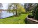 Scenic backyard with access to the water, beautiful greenery, and a private dock at 7371 Windridge Way, Brownsburg, IN 46112