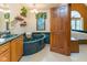 Bathroom featuring jacuzzi tub, granite counters and wood cabinets at 7371 Windridge Way, Brownsburg, IN 46112