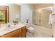 Bathroom with vanity, toilet, shower, and decorative touches for a complete look at 7371 Windridge Way, Brownsburg, IN 46112
