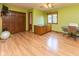Bright bedroom with wood floors, closet, built-in cabinet, and a ceiling fan at 7371 Windridge Way, Brownsburg, IN 46112