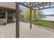 Beautiful covered outdoor deck overlooking the water and lush landscaping at 7371 Windridge Way, Brownsburg, IN 46112