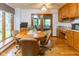 Cozy dining area with wood floors, desk, and large window at 7371 Windridge Way, Brownsburg, IN 46112