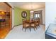 Formal dining room with a stylish light fixture and view into kitchen at 7371 Windridge Way, Brownsburg, IN 46112