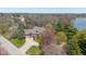 Aerial view of home featuring mature trees, landscaped front yard, and circular driveway at 7371 Windridge Way, Brownsburg, IN 46112