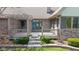 Inviting front porch with decorative flower boxes and manicured landscaping at 7371 Windridge Way, Brownsburg, IN 46112