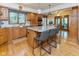 Spacious kitchen with granite countertops, stainless steel appliances, and a breakfast bar at 7371 Windridge Way, Brownsburg, IN 46112
