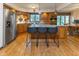 Well-equipped kitchen with a large island, stainless steel appliances, and hardwood floors at 7371 Windridge Way, Brownsburg, IN 46112