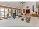 Bright and airy living room with large windows, comfortable seating, and a view of the outdoors at 7371 Windridge Way, Brownsburg, IN 46112