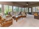 Bright sunroom with wicker furniture and lots of natural light at 7371 Windridge Way, Brownsburg, IN 46112