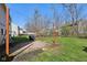Backyard patio with a swing, covered grill, and a fire pit at 7418 Bluebird Ct, Indianapolis, IN 46254