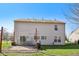 Back of the house with a patio and a swing surrounded by a fenced yard at 7418 Bluebird Ct, Indianapolis, IN 46254