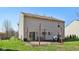 View of the back of the house with a patio, swing, and a grill at 7418 Bluebird Ct, Indianapolis, IN 46254