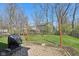 Backyard patio with a swing, covered grill, and fire pit at 7418 Bluebird Ct, Indianapolis, IN 46254