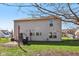 Backyard with a brick patio, swing, and covered grill at 7418 Bluebird Ct, Indianapolis, IN 46254