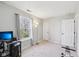Neutral bedroom with a large window, desk, and plenty of space at 7418 Bluebird Ct, Indianapolis, IN 46254