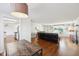 Open concept living area featuring hardwood floors, fireplace and natural light at 7418 Bluebird Ct, Indianapolis, IN 46254