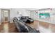 Hardwood floors and a sectional sofa in the living room of this property at 7418 Bluebird Ct, Indianapolis, IN 46254