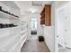 Spacious walk-in closet with custom shelving for optimal organization, plus a hall to a bedroom at 7418 Bluebird Ct, Indianapolis, IN 46254