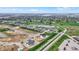 Aerial view shows the community's integration with golf course, pond, and fountain water feature at 749 Meadowbrook Ln, Franklin, IN 46131