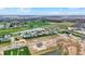 An aerial view captures new homes in a community with a pond and golf course at 749 Meadowbrook Ln, Franklin, IN 46131