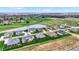 Aerial view showcases a neighborhood with a water feature and a golf course in the background at 749 Meadowbrook Ln, Franklin, IN 46131