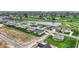 Expansive aerial view shows neighborhood development with golf course, water features, and green spaces at 749 Meadowbrook Ln, Franklin, IN 46131