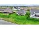 An aerial view showcases the home's private backyard with manicured lawn and outdoor seating at 749 Meadowbrook Ln, Franklin, IN 46131