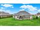 Well-maintained backyard with green lawn and a cozy covered patio, ideal for relaxing and enjoying the outdoors at 749 Meadowbrook Ln, Franklin, IN 46131