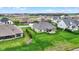 Aerial showcases a well-kept backyard with a lush lawn, perfect for outdoor activities and relaxation at 749 Meadowbrook Ln, Franklin, IN 46131