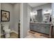 Elegant bathroom featuring double sinks and granite countertops, creating a luxurious spa-like experience at 749 Meadowbrook Ln, Franklin, IN 46131