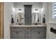Beautiful bathroom features double vanity, granite countertops, and modern lighting at 749 Meadowbrook Ln, Franklin, IN 46131