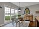 Sunlit dining area featuring a large window with serene outdoor views, creating a peaceful atmosphere at 749 Meadowbrook Ln, Franklin, IN 46131