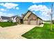 Lovely home with a well-maintained lawn, a two-car garage, and inviting curb appeal at 749 Meadowbrook Ln, Franklin, IN 46131