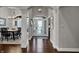 Grand foyer with hardwood floors, elegant lighting, and an arched doorway to the dining room at 749 Meadowbrook Ln, Franklin, IN 46131