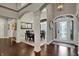 Spacious foyer with hardwood flooring, arched doorways, and a view to the formal dining area at 749 Meadowbrook Ln, Franklin, IN 46131