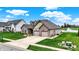 Beautiful home featuring a well-kept lawn, two-car garage, and a scenic view of the lake at 749 Meadowbrook Ln, Franklin, IN 46131