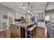 Modern kitchen with a granite island and stainless steel appliances, perfect for cooking and entertaining at 749 Meadowbrook Ln, Franklin, IN 46131