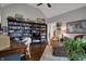 Inviting living room features built-in bookshelves and a cozy seating area with plenty of natural light at 749 Meadowbrook Ln, Franklin, IN 46131