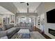 Open concept living area with soaring ceilings, a neutral color palette, and an elegant fireplace at 749 Meadowbrook Ln, Franklin, IN 46131