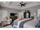 Bright main bedroom with a ceiling fan and dark furnishings, combining style and functionality at 749 Meadowbrook Ln, Franklin, IN 46131