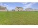 Vast back yard, showcasing a level and grassy lawn, with views of neighboring homes at 771 Carolina Way, Avon, IN 46123