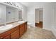 Spacious bathroom featuring double vanity, large mirror, and separate toilet room at 771 Carolina Way, Avon, IN 46123