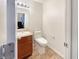 Cozy half-bathroom featuring modern fixtures, vanity, and toilet at 771 Carolina Way, Avon, IN 46123