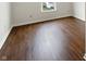 Bright bedroom featuring sleek hardwood floors and a window at 771 Carolina Way, Avon, IN 46123