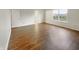 Bright bedroom featuring sleek hardwood flooring and a sunlit window at 771 Carolina Way, Avon, IN 46123