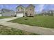 Charming two-story home with a two-car garage, brick and siding exterior, and well-manicured lawn at 771 Carolina Way, Avon, IN 46123