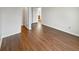 Hallway featuring sleek hardwood floors and neutral colored walls at 771 Carolina Way, Avon, IN 46123