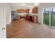 Kitchen and dining area with stainless steel appliances, brown cabinets, and sliding glass door to yard at 771 Carolina Way, Avon, IN 46123