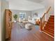 Bright living room featuring modern furniture, striped accents, hardwood floors, and ample natural light at 771 Carolina Way, Avon, IN 46123