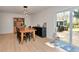 Inviting dining room with a farmhouse-style table, buffet, hutch, and sliding glass doors to the outdoors at 7859 Jennifer Ln, Brownsburg, IN 46112